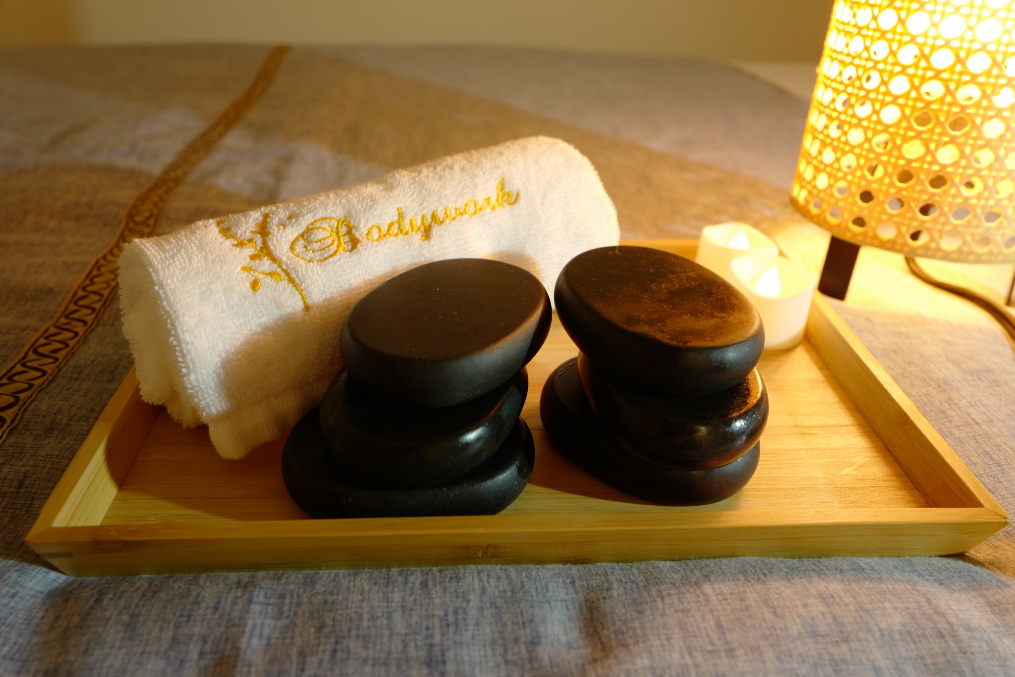 Hot stones with embroidered Bodywork towel